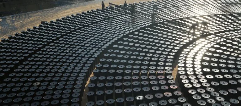 Bitumen drums and tanker truck